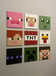 six pixel art pieces are displayed on the wall