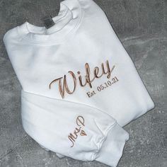 Soft and durable round neck sweatshirt in your choice of colour,  comes in a slightly oversized fit.  Simple , classy and elegant design , which Has been embroidered using the highest quality thread in any thread colour of your choice making this totally unique to you and fit to your colour scheme. Perfect gift for a bride, bride to be or for a hen do.  'Wifey' can be changed to another word, Mrs or Bride for example. And the special date of your choice.  Sleeve embroidery can also be added.  Br Moh Gift To Bride, Fiancee Sweatshirt, Wedding Necessities, Rusting Wedding, Perfect Honeymoon, Fiesta Shirt, Wifey Sweatshirt, Girlfriend Anniversary, Custom Sweaters