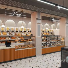 the interior of a bakery with lots of pastries