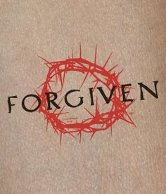 the word forgiven written in red ink with a crown of thorns on it