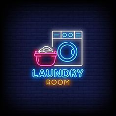 laundry room neon sign with washing machine and bowl on dark brick wall background stock photo