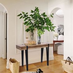 This console table adds a modern farmhouse vibe to your living room, entryway, or hallway. Its rectangular design is crafted from engineered wood with a warm oak finish that highlights the wood grain, including knots, for a natural look. The contrasting black iron legs offer a sleek accent that complements various color palettes. And the narrow yet spacious tabletop is ideal for displaying your favorite lamp or family photos, while also providing a spot for your keys and bag. This piece is all a Black Foyer Table, Small Entryway Tables Black, Black Console Table Entryway Rustic, Color Console Small Table Black, Small Den, Black Metal Console, 32” Wide Farmwood Console Table, Narrow 35" Long Wood Rectangular Console Tables, Entrance Table