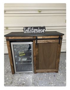 a small refrigerator with the door open and a sign that says, south farmader