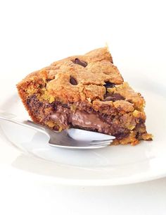 a piece of chocolate chip cookie cake on a plate with a fork