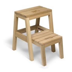 a small wooden step stool sitting on top of a white floor