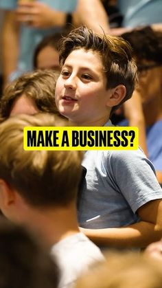 a young boy sitting in front of a group of people with the words make a business?