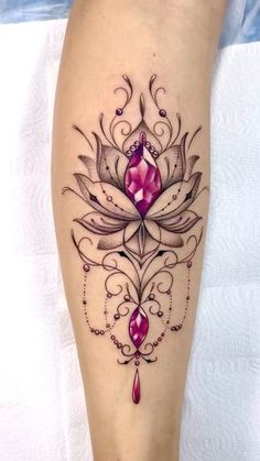 a woman's leg with a tattoo on it and a flower in the center