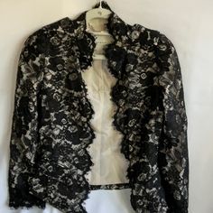 This Karen Millen Cropped Black Lace Jacket Is In Excellent Condition With No Flaws. It Has A Nude Color Silk Lining. Size 4. This Jacket Is To Be Worn Open, It Has No Closures. Originally Over $400. Pit To Pit 15.5” Top Of Shoulder To Bottom 20” All Measures Are Approximate Black Lace Jacket, Lace Jacket, Nude Color, Karen Millen, Blazer Suit, Black Lace, Suit Jacket, Jackets & Coats, Size 4