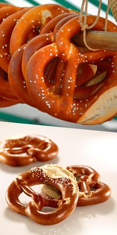 some pretzels and other food items are on a table next to each other