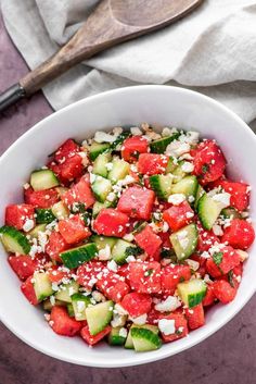 watermelon salad with cucumber and feta in a white bowl