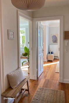 the hallway is clean and ready for us to use as an entrance way in this home