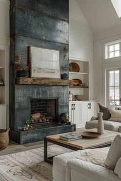 a living room filled with furniture and a fire place in the middle of a room