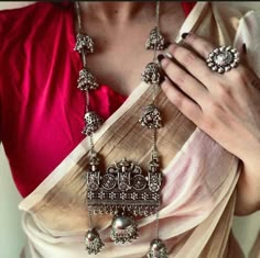 With the significant Indian festivals just around the corner, style up your game with these exquisite sets of oxidized German silver Indian jewelry. Pair the Indian jewelry set with a simple flowy saree or a casual shirt to turn up the style quotient. This beautiful set of oxidized jewelry comes with a pair of matching exquisite earrings set, ring, and a long chain necklace, all of which features playful jhumkis and ghungroo to make your appearance bold and playful. Try out this Indian jewelry t Luxury Oxidized Temple Necklace For Rituals, Oxidized Finish Necklace For Festivals, Silver Indian Jewelry, Matte Gold Necklace, Hand Cuff Bracelet, Oxidised Silver Jewelry, Bracelets Etsy, Long Chain Earrings, Oxidized Necklace