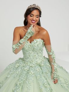 Captivate the room in this 3D floral applique long strapless cape dress with A-line skirt by House of Wu 26070. Romantic quinceañera dress features a strapless sweetheart neckline. The bodice is adorned with three-dimensional lace appliqués that trails past the natural waist and cascades down the sparkle tulle ball gown skirt. Lace-up back, matching lace gloves and cape complete the look. Has a lace-up back and sweep train. The removable gloves and cape are included - giving you a versatile look Dramatic Skirt, Sheer Gloves, Quinceanera Collection, Tulle Balls, Mermaid Evening Gown, Fit Models, Trumpet Dress, Corset Dress Prom, Strapless Sweetheart Neckline