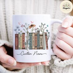 a woman is holding a coffee mug with books on it and the words custom name