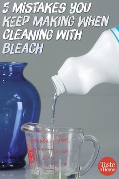 a blue pitcher pouring water into a glass next to a blender and measuring cup