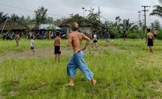 a group of people playing soccer in a field