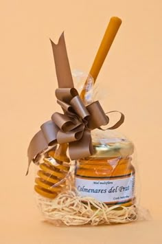 a jar filled with honey sitting on top of a table