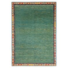 a green rug with red, yellow and blue accents