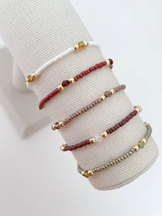 one seed bead stacking bracelet with 14k gold accent beads bracelets are made on a durable stretch elastic cord please refer to our sizing guide before purchasing Trendy Beaded Bracelets Diy, Seed Bead And Crystal Bracelets, String And Bead Bracelets, Simple Bracelets Diy Beads, Small Buissnes Bracelet, Dainty Beaded Jewelry, Stack Bracelets Beaded, Masculine Beaded Bracelets, Simple Seed Bead Bracelets