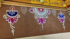 the wall is decorated with colorful designs on it