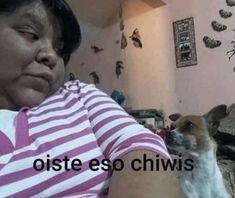 a woman holding a dog in her arms with the caption, oste eso chiwis