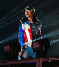 a woman standing on top of a stage