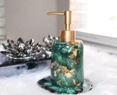 a green soap dispenser sitting on top of a white fur covered floor