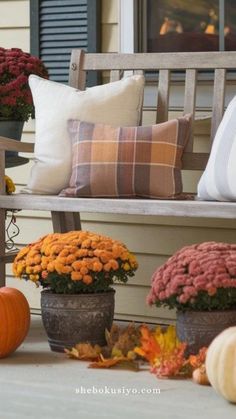 fall decorations on the front porch with pumpkins and gourds