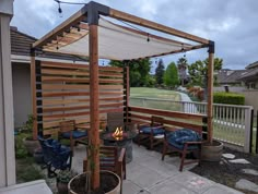 an outdoor patio with seating and fire pit