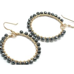 Faceted Hematite Wrapped Gold Filled Hoop Earrings Approx. 1.75" Long Approx. 1.25" Wide Handcrafted at Beads of Paradise Hematite is the mineral form of iron, and is mined as the main ore of iron. The name Hematite is derived from the Greek word for blood, because Hematite can be red (as in jewelers' polishing rouge, a powdered form of hematite). The color of Hematite lends itself well in use as a pigment. It is usually formed in places with standing water or hot springs, such as the western Un Gold Filled Hoops, Gold Hoop Earrings, Hot Springs, Gold Filled, Springs, Paradise, Hoop Earrings, Beads, Water