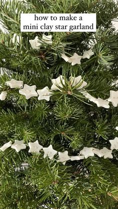 a christmas tree with white ornaments hanging from it's branches and the words, how to make a mini clay star garland