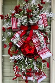 a christmas wreath hanging on the front door