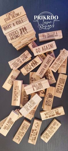 some wooden stamps that are on top of a black surface with the words go again