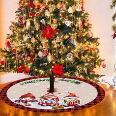 a christmas tree with ornaments on it and a red and white checkered round rug