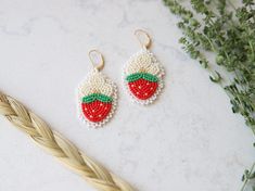 Strawberries hold a special place in Anishinaabe culture and we celebrate strawberry season with strawberry socials in early summer. These earrings are hand-beaded at my home in Ontario, Canada using an applique stitch and beaded edging. I used premium glass beads, a real deer hide (leather) backing and gold-plated lever back closures. Alternatively, I can use silver earring closures if you prefer. Beaded Strawberry, Beaded Edging, Applique Stitches, Strawberry Season, Deer Hide, Floral Earrings, Silver Earring, Ontario Canada, Hand Beading