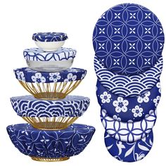 blue and white dishes are stacked on top of each other, with one bowl in the middle