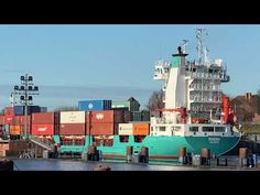 a large cargo ship is docked at the dock