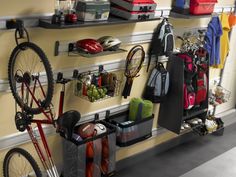 there is a bike and other items on the wall in this garage storage area,