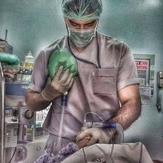 a man in scrubs is operating on an oxygen tube while wearing a surgical mask