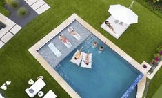 an aerial view of people lounging in the pool