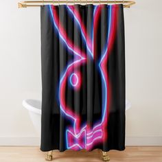 a shower curtain with an image of a rabbit in neon colors on it's side