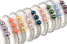 Pearls of Hope Bracelet - This gorgeous, eye-catching bracelet is a Choose Hope favorite!  Aptly named Pearls of Hope, it features silver plated beads with three stunning. Handmade Pearl Bracelet For Spring, Elegant Multicolor Stretch Bracelet As A Gift, Handmade Pearl Stretch Bracelet, Elegant Handmade Pearl Stretch Bracelet, Handmade Pearl Crystal Bracelet, Elegant Hand-set Pearl Bracelet For Festivals, Hope Bracelet, Choose Hope, Ribbon Bracelets