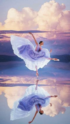 a woman in a purple dress is dancing on the water with clouds and blue sky behind her