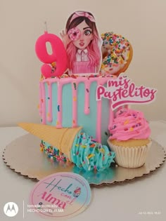 a birthday cake with frosting, sprinkles and donuts on it