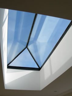 the skylight is shining brightly into the room