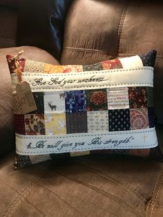 a patchwork pillow sitting on top of a couch