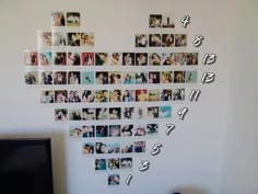 the wall is covered with many different pictures and numbers, all arranged in heart shape