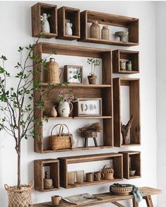 a wooden shelf filled with lots of shelves and vases on top of each other