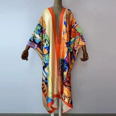 One Size fits S-3X/4X Material: Poly Silk (a lightweight, smooth, and shiny fabric that drapes and flows very well. An affordable alternative to silk) One Size Fits Most Size Chart Spring Party Satin Kimono, Long Silk Kimono For Spring, Spring Silk Long Kimono, Spring Long Silk Kimono, Summer Silk Kimono Flowy Fit, Summer Multicolor Silk Kimono, Flowy Silk Kimono For Summer, Flowy Silk Summer Kimono, Spring Party Multicolor Kimono